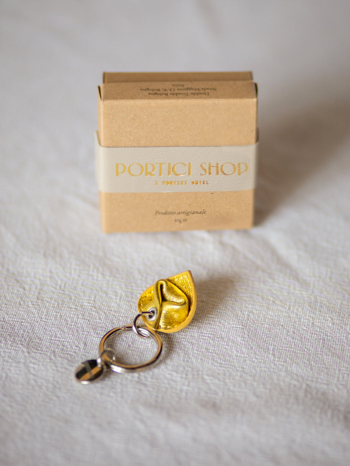 Portachiave Tortelliino — Oro
